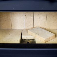 an oven door with some bricks in it