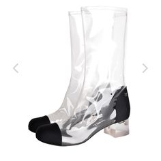 Chanel Clear And Black Cap Toe Boots Rare Find Size 38 No Box No Dust Bags Fits Like 8 Incredibly Cool *Future Vintage* Chanel Boots, From The Spring/Summer 2018 Runway, Which Featured All See Through Footwear In Different Colors And Variations. This Pair Features A Transparent Vinyl Upper With Black Grosgrain Fabric Toe And Heel Caps. Chunky Clear Lucite Block Heel. Silver Cc Logos At Each Outer Side. Mid Calf Height. These Boots Pull On. Leather Lined, Leather Soles. Vent Holes Throughout For Chanel Rubber Boots, White Transparent Boots, Chanel Lace Up Boots, Chanel Cap Toe, Chanel Black Ankle Boots, Vinyl Area, Cap Toe Boots, Chanel Boots, Boot Pulls