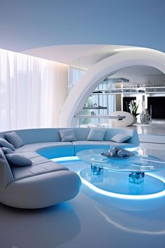 a modern living room with curved couches and blue lighting