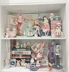 a book shelf filled with figurines and books