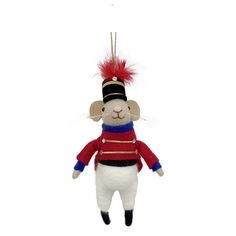 a stuffed animal wearing a red, white and blue outfit is hanging from a string