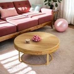 a living room filled with furniture and a pink ball in the middle of the floor