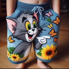 a close up of a child's shorts with an image of a cat on it