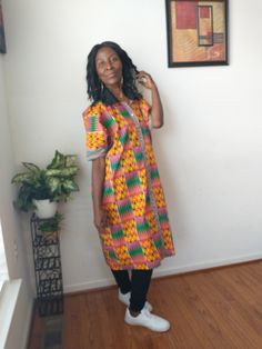 African Handmade oversized Boho kaftan kimono dress top, made with 100% cotton African, kitenge, mud cloth fabric. Dress up or down with this colorful kente kimono dress top. Front open with buttons  Black collar Chest-42" Length-43.5" Around arm-14.5" Casual Multicolor Tunic Kimono, Casual Tunic Kaftan, Multicolor Cotton Kaftan For Spring, Spring Multicolor Cotton Kaftan, Traditional Cotton Tunic Kimono, Multicolor Cotton Tunic Kimono, Green Tunic With Kimono Sleeves, Spring Yellow Cotton Kaftan, Multicolor One Size Cotton Kimono