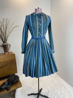 "1960's Blue And Green Stripe Shirt Dress This is such a great shirt dress. The stripes and the careful placement of them make this shirt dress next level attractive. Just check out the pictures and see how the stripes were perfectly utilized to make a regular cut shirt dress into something special. This dress is a button front closure, has her makers tag, which is frayed. Maker is Carol Rodgers Juniors Measurements provided are flat and have been doubled. Bust 34\" Waist 25\" Hips free\" Length Vintage Striped Dress, 60s Cocktail Dress, Heart Blouse, Vintage Dresses 1960s, Cut Shirt, 1960's Dress, Striped Shirt Dress, Special Dresses, 60s Dress