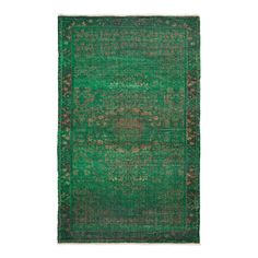 a green rug with an intricate design on the middle and bottom, it is in very good condition