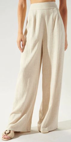 Looking for the perfect pair of pants to suit any occasion? Look no further than our Nice Knowing You Pants in natural linen. These versatile trousers boast a natural, neutral color and lightweight linen blend fabric, making them perfect for any season. With a high waist and hidden side zipper, they offer a flattering fit that maintains a relaxed silhouette throughout, flaring out to a wide leg for maximum comfort. Dress them up with a flowy top and wedges or keep it casual with a basic tee and High Waist Linen Pants, Linen Pants Design, Linen Pants Sewing Pattern, Lenin Pants, Cotton Trousers Women, Neutral Trousers, Wardrobe Aesthetic, Pinterest Wardrobe, Linen Pants Outfit