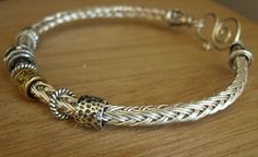 a close up of a bracelet on a table