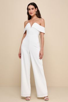 The Lulus My Favorite Night Ivory Off-the-Shoulder Jumpsuit will be your new go-to for an impressive night out look! Stretchy crepe knit fabric shapes a notched, off-the-shoulder neckline (with internal V-bar support and hidden no-slip strips) and a darted bodice with an elegant overlay that flows into short sleeves. High, fitted waist sits atop wide pant legs that fall to full-length hems. Hidden back zipper/clasp. Fit: This garment fits true to size. Length: Floor length. Size medium measures Cute Bar Outfits, Ivory Jumpsuit, Bar Outfits, Wedding Top, Casual Wedding Dress, Wide Pants, Wide Leg Jumpsuit, Spring Outfits, Floor Length