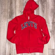 (Nwot) Size: M (10/12) Red With Blue Graphic Levi’s Logo, Full Zipup With Two Pockets In Front. Red Letter Print Hoodie, Red Long Sleeve Sweatshirt For School, Red Sweatshirt For School In Fall, Red Hooded Outerwear For School, Red Winter Top For School, Levi's Cotton Sweatshirt For Winter, Red Cotton Hoodie For School, Red Cotton School Outerwear, Red Cotton Outerwear For School