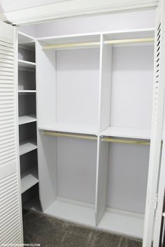 an empty closet with white shelves and no doors