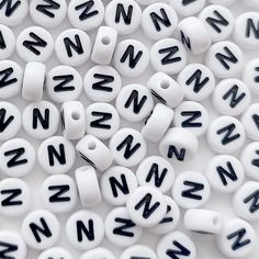 PRICES MAY VARY. 【Package Include】100PCS Acrylic Alphabet Letter Beads Letter N Beads. 【Bead Size】Dameter=7mm/0.27 inch, Thickness=4mm/0.16 inch,Hole=1mm/0.04 inch; Black Letter White Beads,Flat Round White Acrylic Beads. 【Material】Each Letter Alphabet Beads is Made of Acrylic.Clear Patterns,Clean Bead Sides and Holes.Our Beads Has NO Ink/Dirts in the Hole Drilled. Smooth Surface and Exquisite Appearance is a Good Choice for Making Handicrafts. 【Perfect Gift】These Small Plastic White Black Beads Key Chains Diy, Letter Bead Bracelets, Earring Making Supplies, Bracelets Handmade Diy, Making Bracelets, Diy Letters, Alphabet Beads, Jewelry Making Earrings, Jewelry Making Bracelet