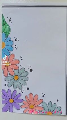 a close up of a paper with flowers on it