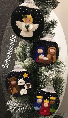 christmas ornament ornaments hanging on a tree in the shape of angels and baby jesus