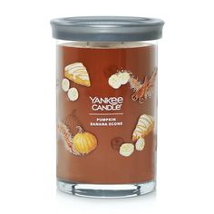 yankee candle pumpkin and banana cookies in a glass jar on a white background with clippings