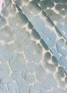 a blue and white blanket with circles on it