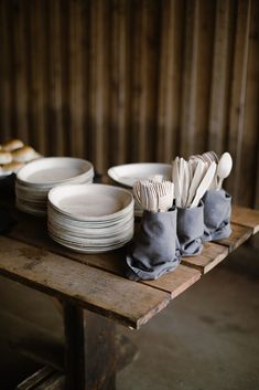 plates and napkins on a wooden table