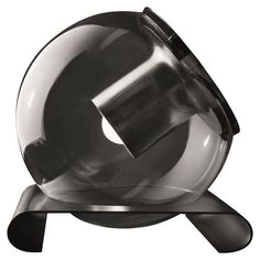 a metal object on a black stand with a white background