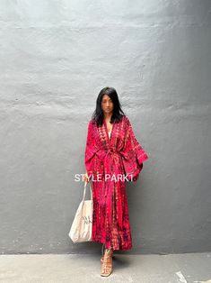 ☎️  make sure to provide your phone number for the shipping to complete ☎️ Bali Tie dyed Kimono long jacket,  It's made by the Bali's traditional   dyed  Perfect for a  summer fashion,with shorts and a tank top or over a summer dress. At home wear  If you are very small this may be too big.  Stylepark1 Model  -Her height is 175Cm/5.74ft weight is 58kg /127Ib  /American size, she wore  ~ M  size.  Made from soft Rayon   At first, you may smell of the unique dye. It will disappear after you wash it. So do not worry. Color : Bali  tie dyed - Warm red   &  multi  motif     One size       Length - 135cm/53inch        Width - Chest & hip          75cm/150cm (59inch) round         I recommend American size M to XL  The dress is made by hand cutting so there could be a 1- 5 +- cm mistake I inform Luxury Summer Maxi Length Kimono, Luxury Maxi Length Summer Kimono, Robe Kim+ono, Luxury Maxi Length Kimono For Summer, Long Kimono Plus Size, Matalan Robe, Luxury Red Bohemian Kimono, Fuzzy Kimono, Dress At Home