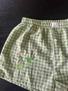 Tequila Lime fruit embroidery on girly summer boxer light green shorts. This design is fun girly personalized. Features a lime, margarita drink and tulip flower collage style.  Elastic band, not super stretchy. On the smaller end.  If you're between a S/M, size up to medium for looser fit. Fun Shorts, Retro Green Summer Shorts, Fun Green Beach Shorts, Green Printed Summer Shorts, Playful Green Summer Shorts, Green Floral Print Beachwear Shorts, Margarita Drink, Flower Collage, Skorts