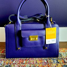 Beautiful Eggplant Purple Purse With Shoulder Strap And Handles. Plenty Of Interior Pockets And An Additional Exterior Pocket. Brushed Brass Hardware. Never Been Used. This Purse Was Part Of A Phillip Lim And Target Collaboration In 2013 And Was Reissued A Couple Years Ago. Collector Item! Everyday Purple Bag With Gold-tone Hardware, Purple Rectangular Bag With Zipper Pocket, Target Purse, Purple Shoulder Bag With Zipper Pocket, Designer Purple Bags With Silver-tone Hardware, Purple Rectangular Shoulder Bag With Gold-tone Hardware, Brushed Brass Hardware, Purple Purse, Eggplant Purple