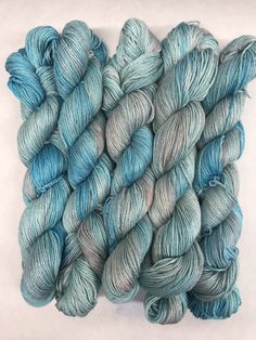 several skeins of blue and gray yarn