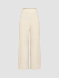 a woman is wearing a cream knit pants with wide legs Chic White Winter Pants, Cream Fall Pants, Cream Full-length Pants For Fall, Fitted Neutral Bottoms For Winter, Cream Full Length Pants For Fall, Full Length Cream Pants For Fall, Cream Stretch Bottoms For Fall, White Bottoms For Workwear In Winter, White Winter Workwear Bottoms