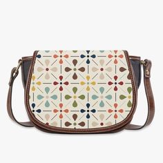 Carry a piece of Scandinavian chic with our Danish Modern Floral Saddle Bag. This mid-century inspired crossbody handbag adds a touch of vintage charm to any outfit. Compact yet spacious, it's perfect for on-the-go style. Bring out your inner flower child today! Key Features ✅ Made of premium PU leather fabric. ✅ Durable adjustable shoulder strap for various occasions. ✅ Classic Flap type & Smooth top zipper closure. ✅ Ultra-large interior capacity, big compartment with 3 pockets for the storage of daily must-haves. Retro Saddle Bag For Daily Use, Retro Saddle Shoulder Bag With Detachable Strap, Retro Saddle Bag With Adjustable Strap For Daily Use, Retro Crossbody Saddle Bag For Everyday Use, Retro Brown Saddle Shoulder Bag, Retro Brown Saddle Bag For Daily Use, White Retro Satchel With Detachable Strap, Retro Beige Satchel With Detachable Strap, Retro Saddle Bag With Adjustable Strap