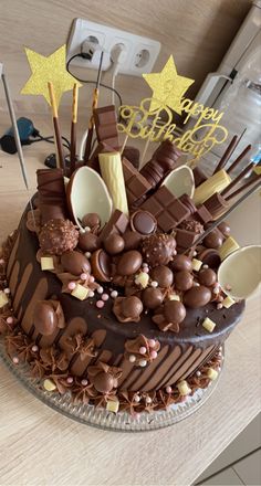 a large chocolate cake sitting on top of a wooden table