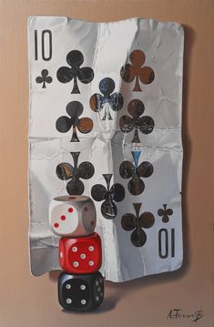 a painting of playing cards and dices hanging on the side of a wall,