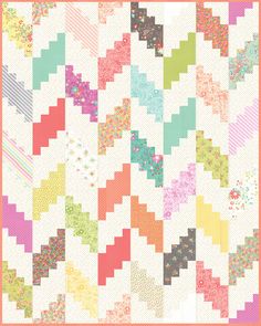 a colorful quilt with many different designs on the front and back, along with an orange border