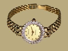 "This exquisite Geneve wristwatch is made of 14k yellow gold and features a stunning 24 round cut diamond bezel, and sapphire crystal. Classic and elegant style, this luxury dress watch is perfect for any occasion. The analog display and quartz movement ensure accurate timekeeping. This watch also has easy on-easy off style fold over style clasp, with two sizing options. Approximately 1.50ct round brilliant diamond  Approximate total weight 20.38 grams Approximate total gold weight 18.10 grams  Will fit 7\" wrist safely  Shipping cost is included anywhere in the US, only." Gold Watches With Diamond Accents For Formal Occasions, Yellow Gold Watches With Diamond Accents As Gift, Yellow Gold Watches With Diamond Accents For Gift, Formal Gold Watches With Diamond Accents, Classic Gold Diamond Watch With Single Cut Diamonds, Luxury Gold Diamond Watch With Single Cut Diamonds, Timeless Gold Watches With Single Cut Diamonds, Gold Diamond Watch With Accents For Anniversary, Formal Gold Diamond Jewelry And Watches