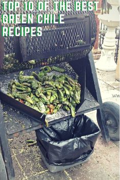 the grill is full of green chilies and black trash bags on the side of the road