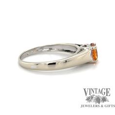 This spessertine garnet solitaire ring is like a ball of fire from the sun with it's radiance, and vibrant orange color! The round center stone is secured in 4 prongs, slightly elevated in a 14 karat gold ring mounting. The stone is approximately .90 carats, with natural coloration. The ring is size 7. Gold Solitaire Ring, Ring Mountings, Vibrant Orange, Solitaire Ring, Orange Color, Garnet, Gold Rings, Stone, Gold