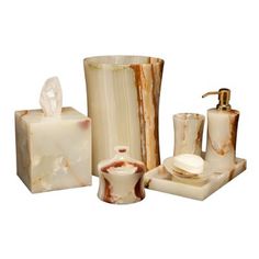 marble bathroom accessories including soap dispenser and toothbrush holder