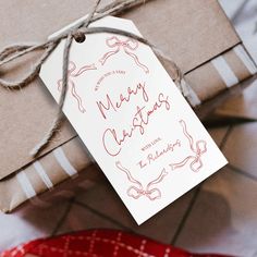 a gift wrapped in brown paper and tied with twine on top of a table