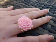 This pretty statement ring has been handmade using a large 24mm carnation rose flower on a silver plated brass filigree adjustable shank. It is comfortably a size R but because of the adjustable shank will fit smaller or larger fingers (the shank measures approximately 18mm across internally). It is available in a choice of colours, which you can choose from the drop-down menu. This ring will be beautifully wrapped in an organza gift bag, and dispatched by second class post/Airmail within 24 hou Pink Flower Ring For Valentine's Day, Pink Flower Ring With Rose Design, Pink Rose Design Ring For Gift, Handmade Pink Flower-shaped Rings, Handmade Pink Flower Rings, Handmade Pink Flower Shaped Rings, Pink Rose Design Flower Ring, Brass Filigree, Jewellery Rings