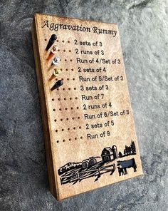 a wooden game board with instructions on it