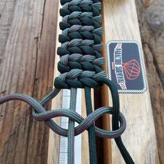 a close up of a rope on top of a piece of wood