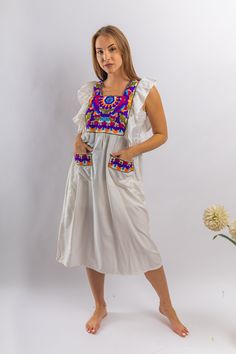 This tunic is a mix of chic, boho, and tribal. The simple consistent embroidery throughout the dress is simple, cute and classy. It is perfect for the summer time. This beautiful bohemian embroidered tunic dress is surely going to add life and oriental charm to your closet. The dress is made of Egyptian cotton which is widely renowned for its quality and texture. The dress is light and extremely soft and can be used on many occasions - beach, lounge, or even in your home to feel comfortable. Fab Bohemian Tunic Dress With Pockets, White Bohemian Cotton Peasant Dress, Summer Tunic With Embroidered Sleeves, White Sleeveless Embroidered Dress For Festival, White Sleeveless Embroidered Festival Dress, White Summer Folk Style Tunic, White Folk Tunic For Summer, White Summer Folk Tunic, White Folk Style Summer Tunic