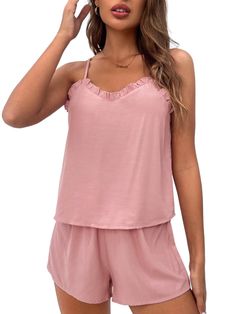 This Trim Lounge Cami Top And Shorts is the ideal choice for those moments when you want to relax and feel comfortable. The set comes with a top and bottom made from knitted fabric that offers medium stretch and a soft feel. The top features a round neckline and sleeveless cut, while the bottoms have an adjustable knot waistband for added comfort. With its casual design, this lounge set will make lounging around even more fun. Features: Style: Casual Pattern Type: Plain Type: Short Sets Color: Pink Material: Woven Fabric Pants & Tops Composition: 100% Viscose Neckline: Spaghetti Strap Number of Pieces: 2 Piece Set Sleeve Length: Sleeveless Fabric: Slight Stretch Sheer: No Color: Pink Size Chart (cm): Top Size Size US Bust Length XS 2 88 50 S 4 92 51 M 6 96 52 L 8/10 102 53.5 Pant Size Size Comfortable Seamless Loungewear Top, Comfortable Seamless Tops For Loungewear, Summer Viscose Sleepwear For Loungewear, Casual Seamless Pajama Shorts For Loungewear, Soft Touch Tops For Loungewear, Casual Seamless Solid Color Sets, Summer Seamless Pajama Shorts For Loungewear, Soft Touch Tops For Lounging, Summer Sleepwear In Viscose