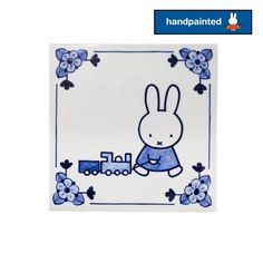 a blue and white plate with a rabbit on it