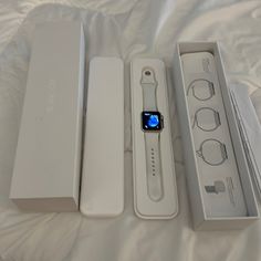 an apple watch is sitting in its box on the bed