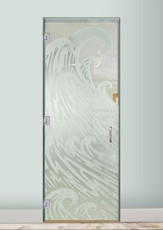 a glass door with an artistic design on the front and side panels that are frosted