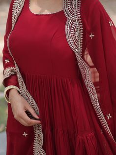 This elegant gown is made from high-quality georgette material in a beautiful plain maroon color, making it the perfect choice for any special occasion. The gown comes with a similar color georgette dupatta that features rich sequins embroidered work and designer lace detailing, adding an extra touch of glamour to your outfit.
This maroon gown is its versatility. Whether you're attending a festival, event, or any other function, this gown is sure to make you stand out from the crowd. The fully s Red Georgette Anarkali Set With Mirror Work, Dabka Embellished Party Gown For Diwali, Diwali Party Wear Gown With Dabka, Festive Dabka Party Gown, Diwali Georgette Gown With Sheer Dupatta, Red Mirror Work Churidar For Party, Elegant Maxi Length Dupatta With Dori Work, Elegant Maxi-length Dupatta With Dori Work, Party Wear Maxi Length Churidar With Mirror Work