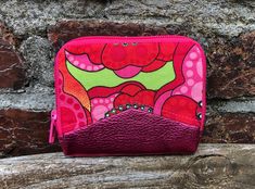 This small, colorful wallet, sewn with love, is ideal for on the go, when going out or if you just want to use a small bag. This mini wallet is a unique piece that impresses with its particularly colorful and unique design and still offers you enough space. You can fit at least 4 - 8 cards, have a compartment for folded banknotes and a coin compartment with snap fasteners. The all-round zipper closes your mini wallet securely. The wallet was sewn with a lot of love and from high-quality, particu Pink Coin Purse With Cell Phone Pocket, Pink Travel Wallet With Zipper Pocket, Travel Wallet With Zipper Pocket In Pink, Pink Pouch Coin Purse With Card Slots, Trendy Pink Coin Purse With Zipper, Retro Pink Wallet For Everyday Use, Trendy Multicolor Wallets For Gifts, Green Coin Purse With Zipper As Gift, Pink Coin Purse With Cell Phone Pocket For Gift