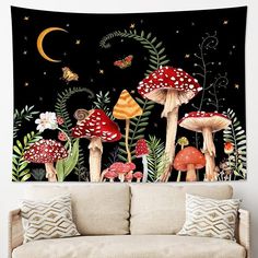 a living room with a couch and wall hanging tapestry featuring mushrooms in the night sky