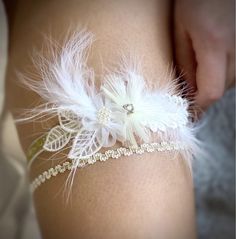 Welcome to our world of exclusive wedding garters! 🪡🪄 SET : ALESSANDRA PLEASE NOTE : THIS WEDDING GARTER IS READY TO GO WITHOUT ANY CHANGES OR AMENDMENTS  SIZE OF THIS GARTER IS 50 - 55 CM ( M/L ) , THIS GARTER ONLY BEEN USED AS A MODEL AND FOR PHOTOS  THIS GARTER IS LAST OF ITS EDITION A set of wedding garters on a flexible base with feathers, lace and beads in shades of white, champagne and beige. ABOUT US IN A FEW LINES AND PHOTOS... We are a company specializing in handcrafted sets of wedd Elegant Adjustable Bridal Accessories For Wedding, Elegant Adjustable Bridal Accessories For Marriage, Elegant White Bridal Belt Gift, Elegant White Bridal Belt As Gift, Personalized Robe, Wedding Garter, Exclusive Wedding, Second Weddings, Wedding Moments