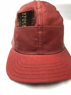 "This Waxed cotton cap in nautical red is meticulously handcrafted with quality materials and construction which results in a cap that will last for years! The front pockets will come in handy or just look cool. This water resistant material will age gracefully when handled. The cracking and wear marks of waxed cottons nature will add character to your own personal cap. The visor is 2.5\" long and the Sweatband is brushed cotton with absorbant felt inside. Fitted to any size." Pre-washed Cotton 5-panel Hat, 5-panel Cotton Dad Hat For Outdoor, Classic Red Cotton Hat, Red Adjustable 5-panel Dad Hat, Red Cotton Six-panel Baseball Cap, Red Six-panel Cotton Baseball Cap, Outdoor Cotton 5-panel Baseball Cap, Red Cotton Six-panel Hat, Red Six-panel Cotton Hat