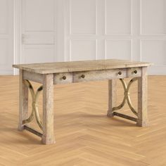 a wooden table sitting on top of a hard wood floor next to a white wall